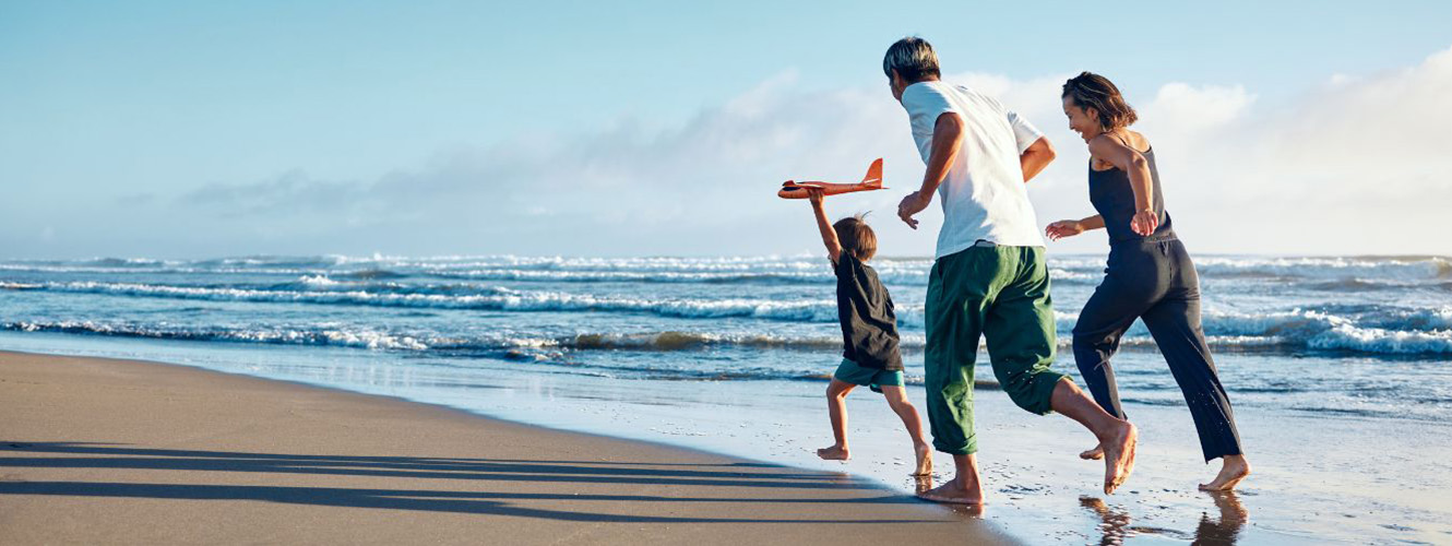 Family running on beach
